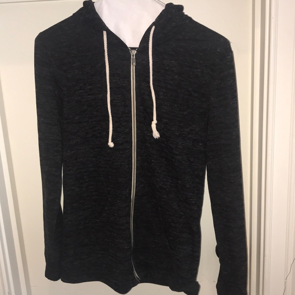 zip up hoodie with pockets and a drawstring
